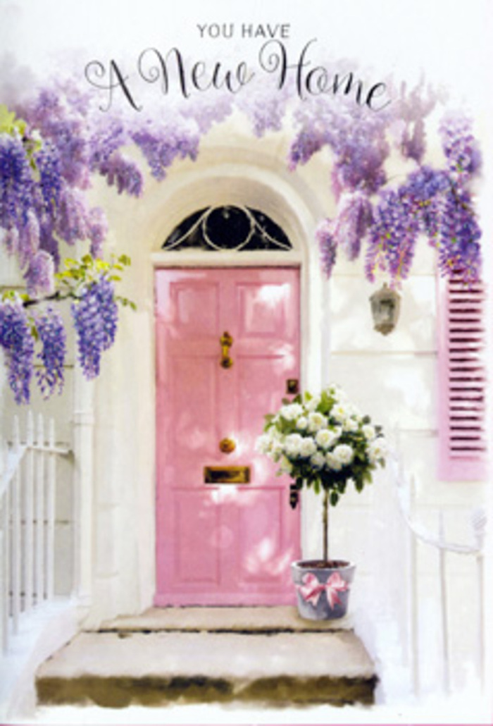 Stepping up to this Mortlake doorway, you enter a scene that seems designed to catch your breath just before you ring the bell. The door itself is painted a gentle, chalky pink, the sort of soothing colour you might glimpse on a quiet side street leading down to the river. Its surface holds faint, visible brushstrokes, hinting at the care taken to refresh the entrance for a new chapter. Overhead, wisteria in full bloom drapes like velvet, its clusters of lavender and lilac blossoms hanging in graceful arcs that soften the lines of the building. The flowers create dappled shadows across the whitewashed wall, the interplay of light and shade reminiscent of the shifting sun over nearby Mortlake Green. To one side, a pastel-toned shutter echoes the door's hue, tying the composition together with a sense of calm unity. At the threshold, a stylish tin bucket has been filled by a florist's steady hand with lush white roses and creamy buds, padded with fresh, soft green foliage that spills just slightly over the rim. A satin pink ribbon encircles the bucket, knotted in an understated bow that mirrors the door's colour in a quieter note. The bouquet feels both classic and deeply personal, the kind of doorstep surprise that might await new homeowners moving into a terrace off Sheen Lane. There is a serene hush to the image, as though the street has fallen silent for this one tender moment when flowers, light, and colour come together to say, without words, this is home now.