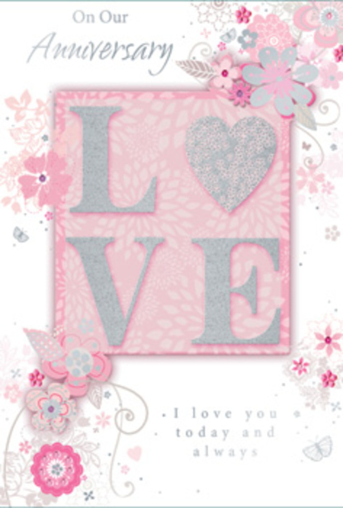 Displayed against a neutral surface, this anniversary card looks like a sunlit keepsake, softly celebrating a love that has grown over many years. Dominating the centre is the word LOVE, printed in tall, confident letters and finished with a frosted pink glitter that sparkles like fine sugar. The raised texture gives each letter a sculpted feel, as though it were carefully outlined by hand, much like a florist in Mortlake shaping each stem in an anniversary bouquet. The background is a warm, blush-pink wash that feels almost luminous, gently fading to paler tones at the edges, as if light were spilling in from a nearby window over Sheen Lane. Along the borders and weaving behind the letters, wispy, hand-drawn blooms unfurl in shades of pink, lilac, ivory, and soft grey. Their petals and leaves are sketched in delicate, curling lines, with occasional flourishes that resemble tiny butterflies or filigree tendrils. These details add a sense of quiet movement, like flowers nodding in a breeze near Mortlake Green. Tucked within the design, a simple phrase such as I love you today and always appears in dignified, graceful type, small enough not to overwhelm the artwork, yet central to its emotion. The card carries the same gentle intimacy as a hand-tied bouquet delivered to a quiet townhouse off the riverside: not showy, but deeply thoughtful. It suggests gratitude, constancy, and the quiet comfort of shared daily life, making it a tender companion to anniversary flowers chosen with care from a trusted Mortlake florist.